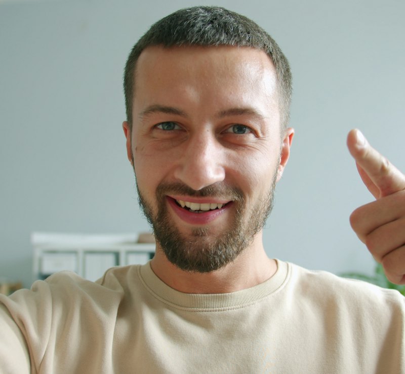 Smiling client giving a thumbs up