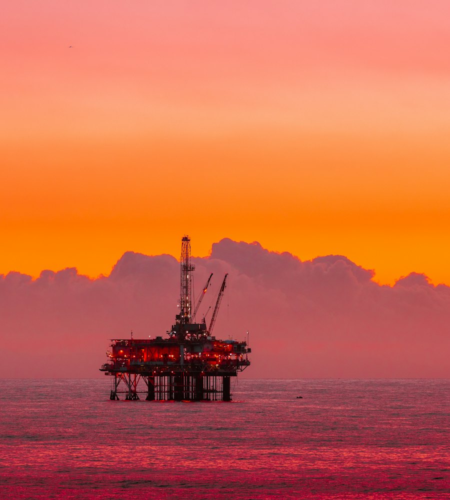 Offshore oil rig at sunset