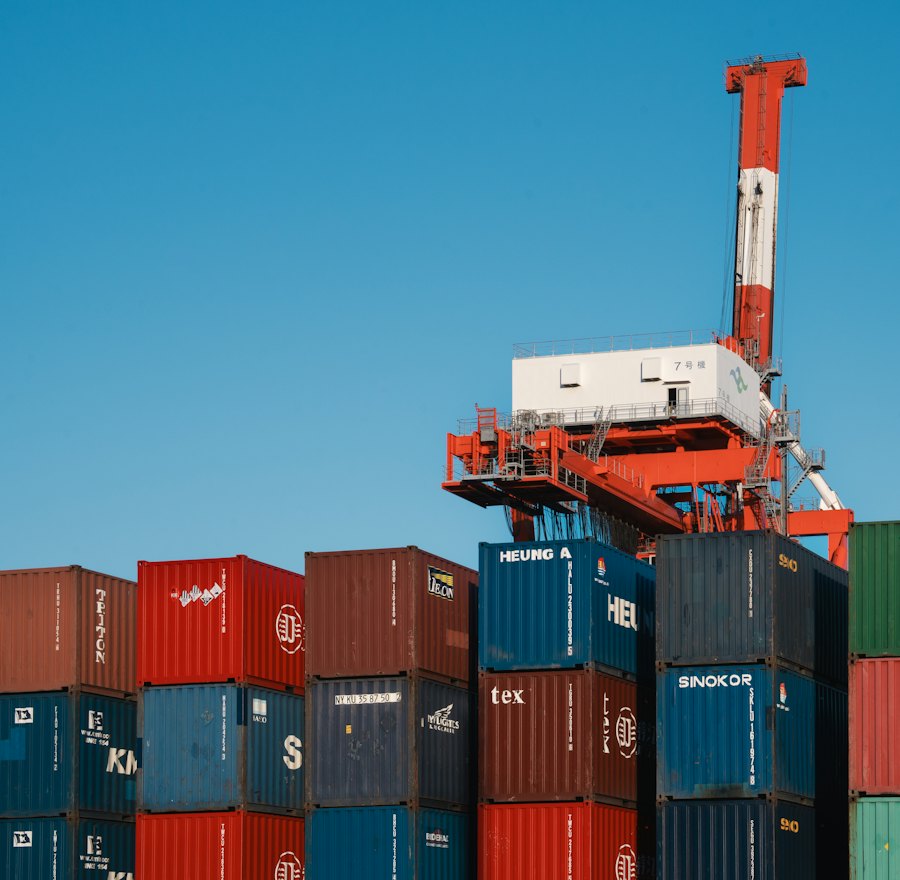 Port crane lifting containers at a terminal
