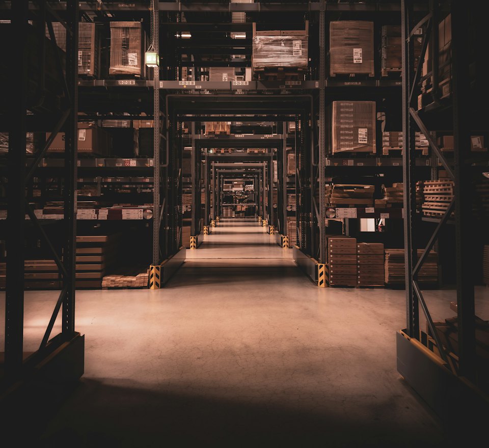 Warehouse aisle with warm lighting