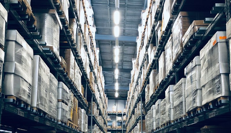 Large warehouse with tall racks of goods